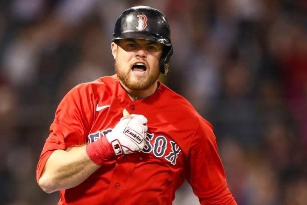 Christian Arroyo of the Boston Red Sox reacts after hitting a three-run home run in the fifth inning of a game against the Houston Astros at Fenway...