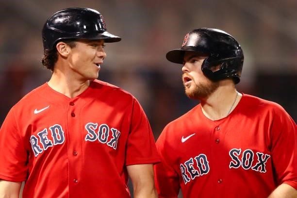Bobby Dalbec rtalks to Christian Arroyo of the Boston Red Sox in the sixth inning of a game against the Houston Astros at Fenway Park on June 10,...
