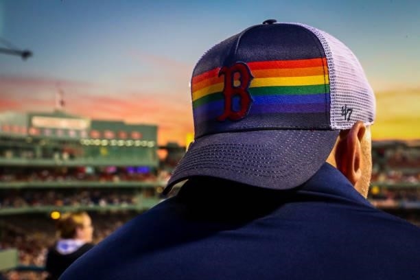 Fan wears a Boston Red Sox pride themed hat on Pride Night during a game against the Houston Astros at Fenway Park on June 10, 2021 in Boston,...