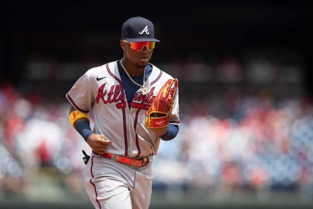 Ronald Acuna Jr. #13 of the Atlanta Braves makes his way to the dugout against the Philadelphia Phillies at Citizens Bank Park on June 10, 2021 in...
