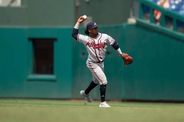 Ozzie Albies of the Atlanta Braves throws the ball to first base against the Philadelphia Phillies at Citizens Bank Park on June 10, 2021 in...