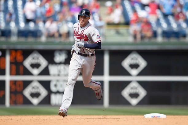 Freddie Freeman of the Atlanta Braves rounds the bases after hitting a solo home run in the top of the ninth inning against the Philadelphia Phillies...