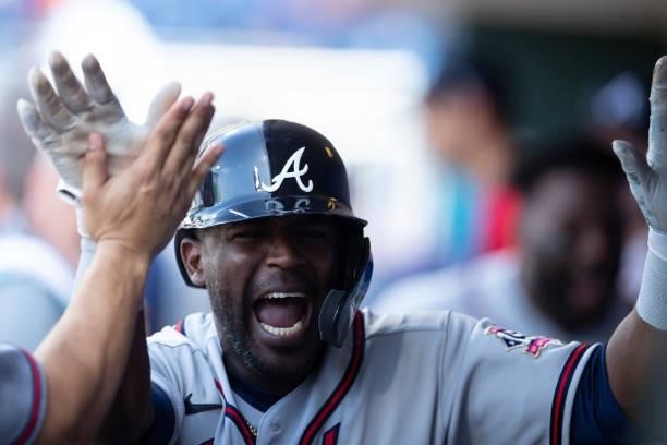 Guillermo Heredia of the Atlanta Braves reacts after scoring a run in the top of the tenth inning against the Philadelphia Phillies at Citizens Bank...