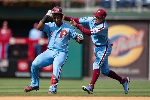 Jean Segura of the Philadelphia Phillies celebrates with Ronald Torreyes after hitting a walk-off two RBI single in the bottom of the tenth inning...