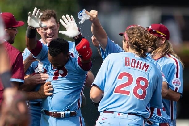 Jean Segura of the Philadelphia Phillies celebrates with hist teammates after hitting a walk-off two RBI single in the bottom of the tenth inning...