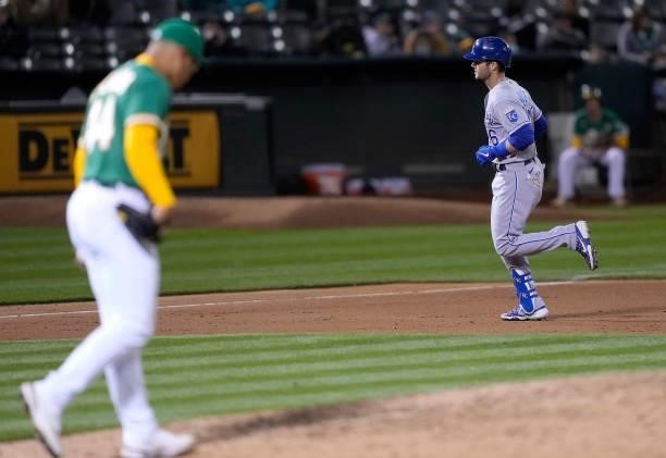 Andrew Benintendi of the Kansas City Royals trots around the bases after hitting a solo home run off of Jesus Luzardo of the Oakland Athletics in the...