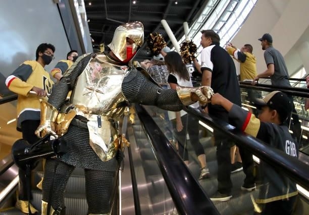 Lee Orchard as the Golden Knight fist bumps a fan as he participates in The March to the Fortress before Game Six of the Second Round of the 2021...