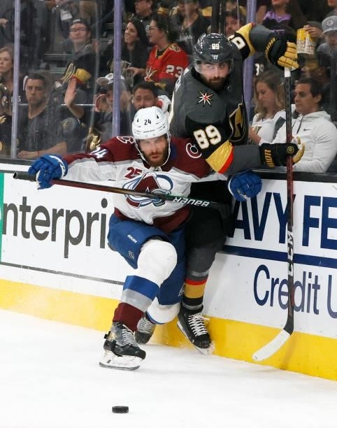 Patrik Nemeth of the Colorado Avalanche and Alex Tuch of the Vegas Golden Knights fight for the puck in the second period in Game Six of the Second...