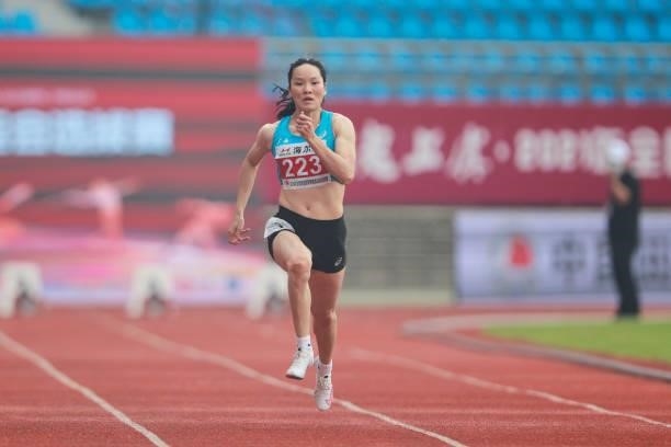 Wei Yongli of Guangxi competes in the Women's 100 Metres heats on day one of 2021 Chinese National Athletics Championships & Tokyo Olympic Trials at...