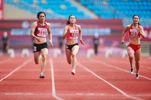 Liang Xiaojing of Guangdong competes in the Women's 100 Metres heats on day one of 2021 Chinese National Athletics Championships & Tokyo Olympic...