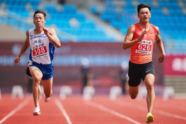 Wu Zhiqiang of Hubei and Xie Zhenye of Zhejiang compete in the Men's 100 Metres heats on day one of 2021 Chinese National Athletics Championships &...