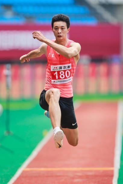 Wu Ruiting of Guangdong competes in the Men's Triple Jump Final on day one of 2021 Chinese National Athletics Championships & Tokyo Olympic Trials at...