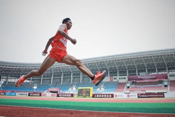 Fang Yaoqing of Shaanxi competes in the Men's Triple Jump Final on day one of 2021 Chinese National Athletics Championships & Tokyo Olympic Trials at...