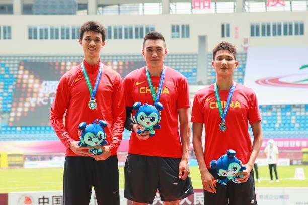 Silver medalist Wu Ruiting of Guangdong, gold medalist Zhu Yaming of Liaoning and bronze medalist Fang Yaoqing of Shaanxi pose on the podium after...