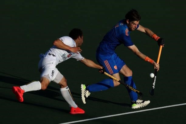 Florent van Aubel of Belgium battles for the ball with Lars Balk of Netherlands during the Euro Hockey Championships Mens Semi Final match between...