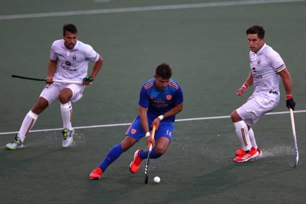 Robbert Kemperman of Netherlands battles for the ball with Cedric Charlier and Simon Gougnard of Belgium during the Euro Hockey Championships Mens...