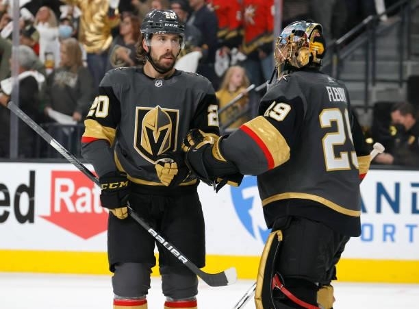 Chandler Stephenson and Marc-Andre Fleury of the Vegas Golden Knights celebrate a third-period empty-net goal by Max Pacioretty against the Colorado...