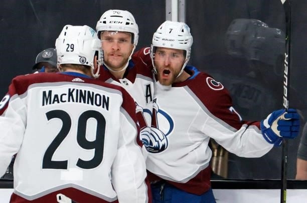 Nathan MacKinnon, Mikko Rantanen and Devon Toews of the Colorado Avalanche celebrate Toews' first-period goal against the Vegas Golden Knights in...