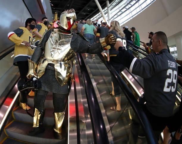 Lee Orchard as the Golden Knight fist bumps a fan as he participates in The March to the Fortress before Game Six of the Second Round of the 2021...