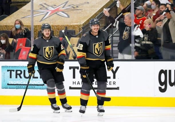 Mattias Janmark and Nick Holden of the Vegas Golden Knights smile after Holden scored a first-period goal against the Colorado Avalanche in Game Six...