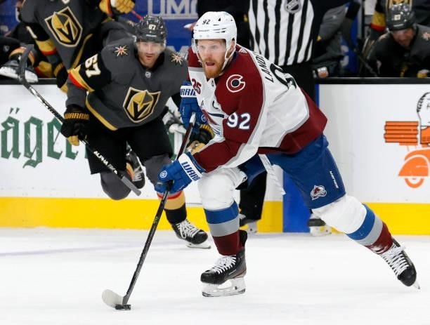 Gabriel Landeskog of the Colorado Avalanche skates with the puck ahead of Max Pacioretty of the Vegas Golden Knights in the first period in Game Six...