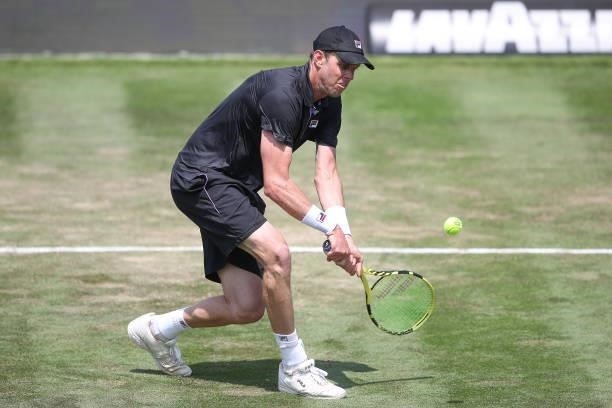 Sam Querry of United States of America plays a backhand during his match against Dominic Stricker of Switzerland during day 5 of the MercedesCup at...