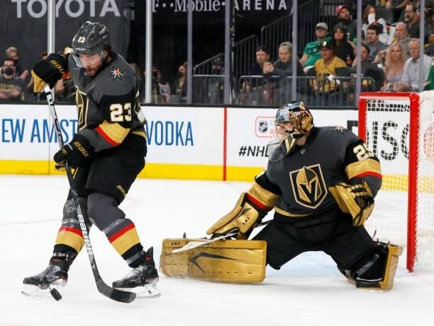 Alec Martinez of the Vegas Golden Knights clears the puck as Marc-Andre Fleury defends the net against the Colorado Avalanche in the first period in...
