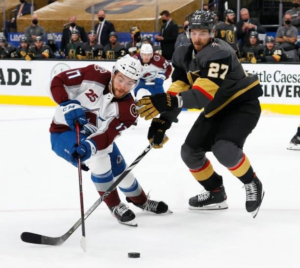 Tyson Jost of the Colorado Avalanche skates with the puck against Shea Theodore of the Vegas Golden Knights in the first period in Game Six of the...