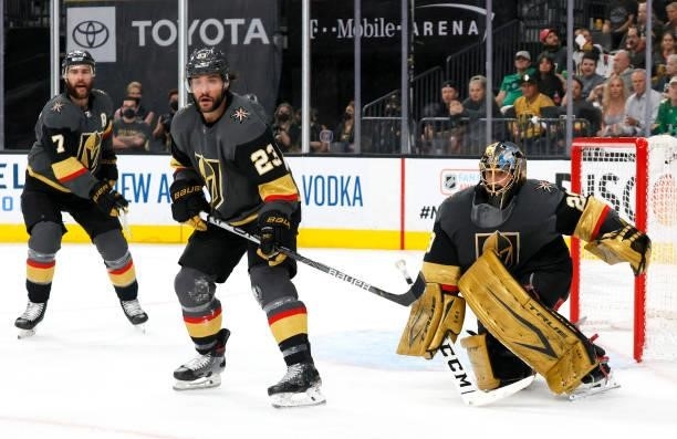 Alex Pietrangelo, Alec Martinez and Marc-Andre Fleury of the Vegas Golden Knights defend the net against the Colorado Avalanche in the first period...