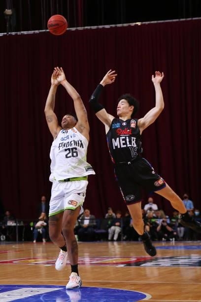 Ben Moore of the Phoenix and Yudai Baba of United compete for the ball during game one of the NBL Semi-Final Series between Melbourne United and the...