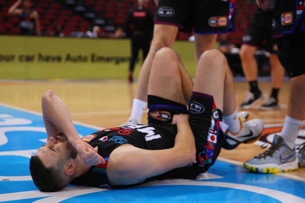 Chris Goulding of United lies injured during game one of the NBL Semi-Final Series between Melbourne United and the South East Melbourne Phoenix at...