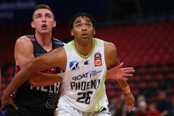 Mason Peatling of United and Ben Moore of the Phoenix compete for the ball during game one of the NBL Semi-Final Series between Melbourne United and...