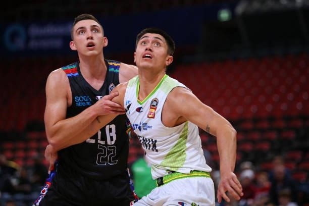Mason Peatling of United and Reuben Te Rangi of the Phoenix compete for the ball during game one of the NBL Semi-Final Series between Melbourne...