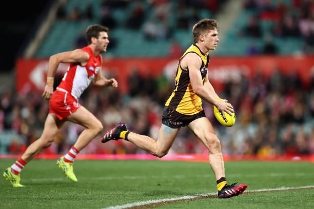 Dylan Moore of the Hawks makes a break during the round 13 AFL match between the Sydney Swans and the Hawthorn Hawks at Sydney Cricket Ground on June...