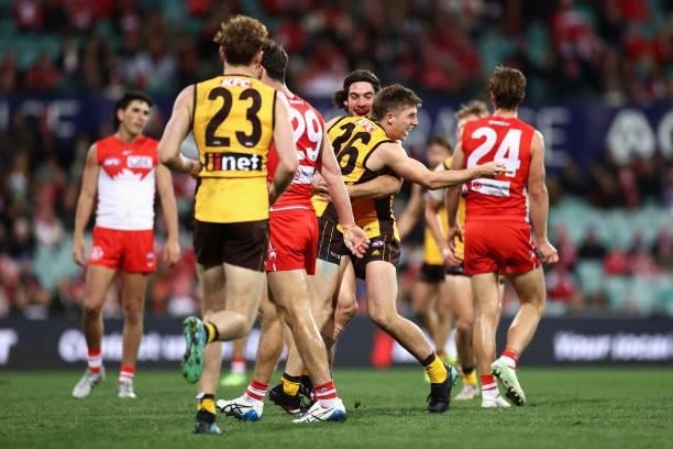 Dylan Moore of the Hawks celebrates kicking a goal with team mates during the round 13 AFL match between the Sydney Swans and the Hawthorn Hawks at...