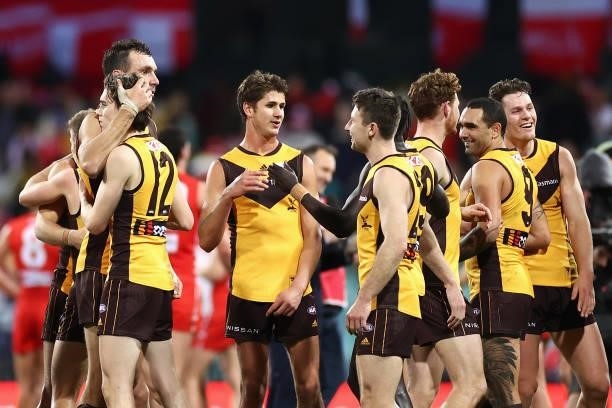 Hawks players celebrate winning the round 13 AFL match between the Sydney Swans and the Hawthorn Hawks at Sydney Cricket Ground on June 11, 2021 in...