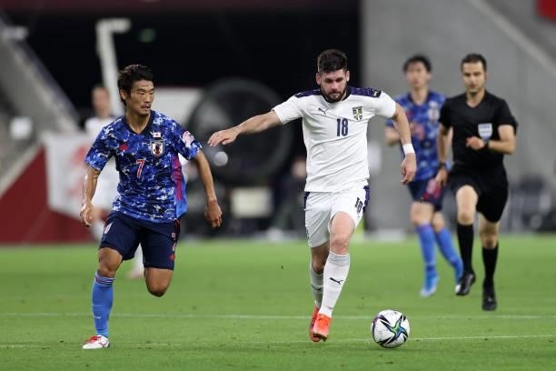 Milan Makaric of Serbia and Hidemasa Morita of Japan compete for the ball during the international friendly match between Japan and Serbia at Noevir...
