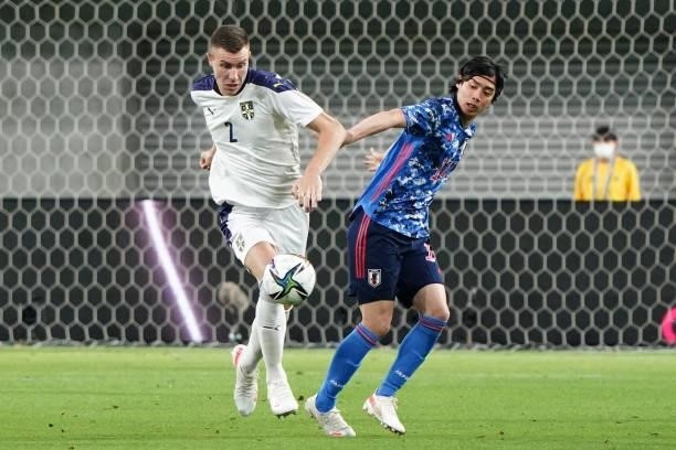 Strahinja Pavlovic of Serbia and Junya Ito of Japan compete for the ball during the international friendly match between Japan and Serbia at Noevir...