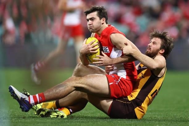 Logan McDonald of the Swans is tackled during the round 13 AFL match between the Sydney Swans and the Hawthorn Hawks at Sydney Cricket Ground on June...