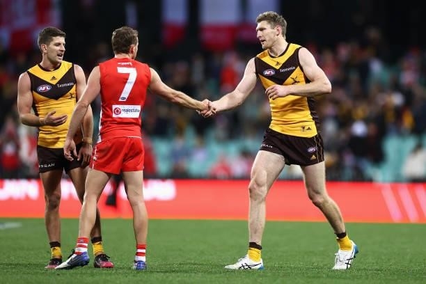 Harry Cunningham of the Swans and Ben McEvoy of the Hawks shake hands following the round 13 AFL match between the Sydney Swans and the Hawthorn...