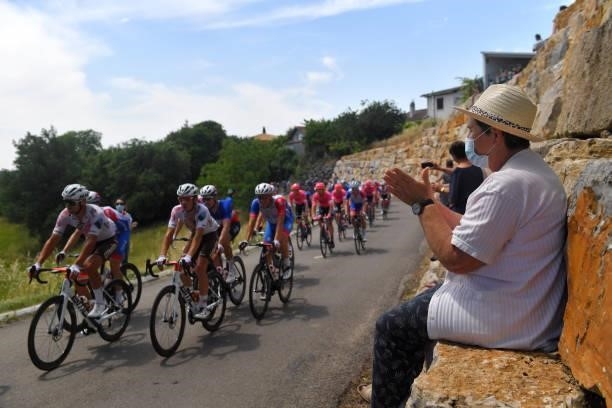 The Peloton during the 45th La Route d'Occitanie - La Depeche Du Midi 2021, Stage 2 a 198,7km stage from Villefranche-de-Rouergue to Auch 174m / Fans...