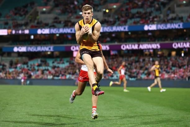 Dylan Moore of the Hawks marks during the round 13 AFL match between the Sydney Swans and the Hawthorn Hawks at Sydney Cricket Ground on June 11,...
