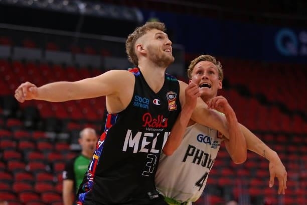 Jock Landale of United and Kyle Adnam of the Phoenix compete for the ball during game one of the NBL Semi-Final Series between Melbourne United and...