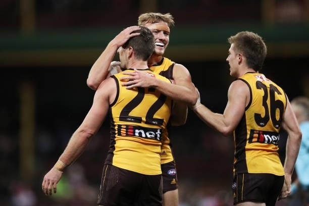 Luke Breust of the Hawks celebrates with team mates after kicking a goal during the round 13 AFL match between the Sydney Swans and the Hawthorn...