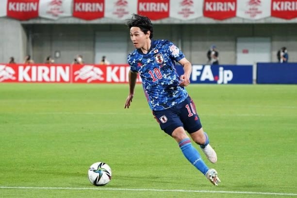Takumi Minamino of Japan in action during the international friendly match between Japan and Serbia at Noevir Stadium Kobe on June 11, 2021 in Kobe,...