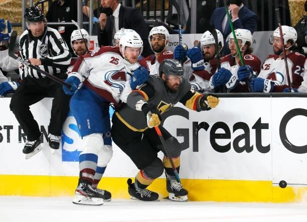 Mikko Rantanen of the Colorado Avalanche and William Carrier of the Vegas Golden Knights battle for the puck in the second period in Game Six of the...