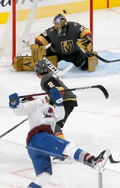 Mikko Rantanen of the Colorado Avalanche scores a second-period power-play goal against Zach Whitecloud and Marc-Andre Fleury of the Vegas Golden...