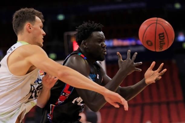 Jo Luai-Acuil of United competes for the ball with Yannick Wetzell of Phoenix during game one of the NBL Semi-Final Series between Melbourne United...
