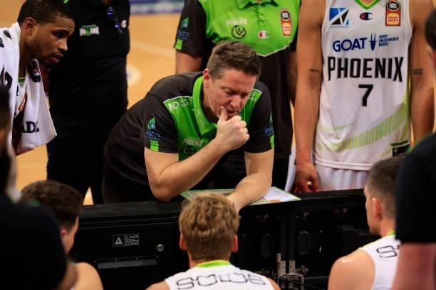 Simon Mitchell, head coach of Phoenix, talks to his players in a time out during game one of the NBL Semi-Final Series between Melbourne United and...