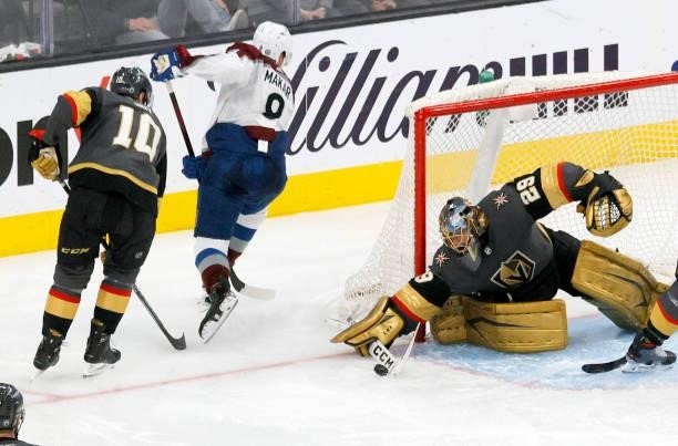 Marc-Andre Fleury of the Vegas Golden Knights cuts off a pass from Cale Makar of the Colorado Avalanche as Nicolas Roy of the Golden Knights defends...